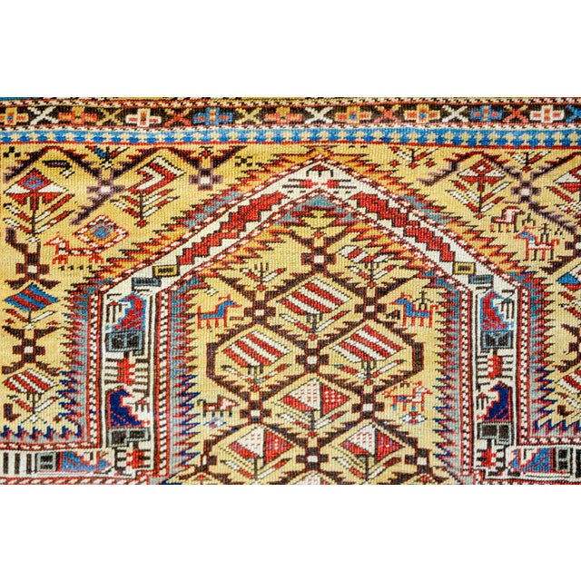 An extraordinary late 19th century Persian Shirvan prayer rug with an incredible stylized multicolored floral pattern...