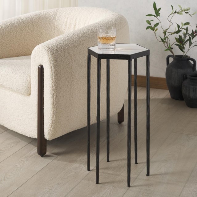 Immerse yourself in an ambiance of elegance and style with our exquisite Galvin Marble Top Drink Table. This luxurious...