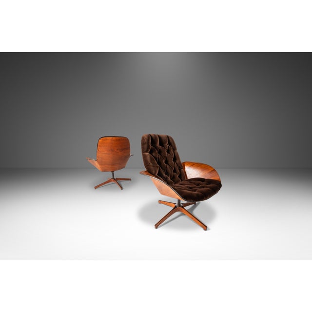 Introducing a true Mid Century Modern masterpiece: a rare set of two matching Low Back Swivel Lounge Chairs designed by...