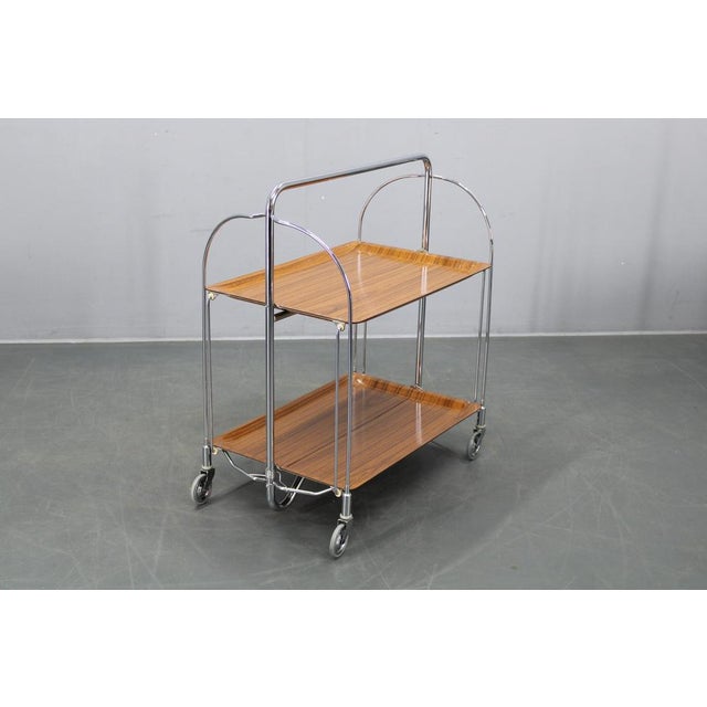 This refined mid-century folding serving cart was produced in Italy during the 1970s and reflects the era’s focus on...