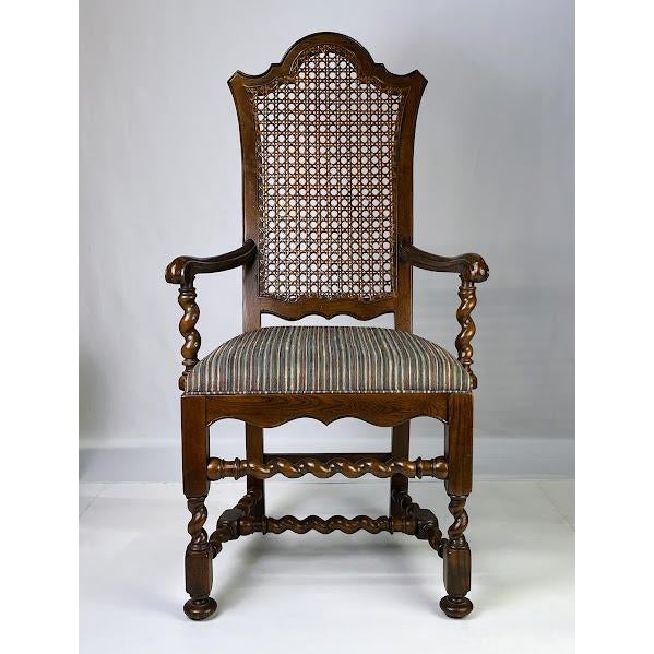 This set of six dining chairs by Baker Furniture features a silhouette inspired by 17th-century English design. Crafted...