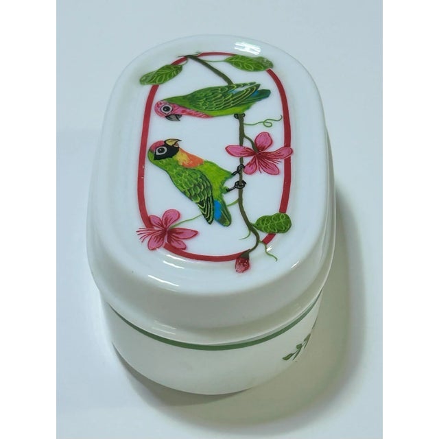 A charming Lynn Chase “Parrots of Paradise” porcelain box featuring colorful tropical birds and botanical detailing. This...