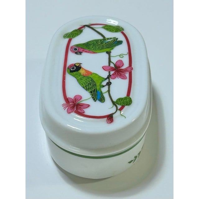 A beautiful little porcelain box designed by Lynn Chase. It's called Parrots of Paradise. It's a discontinued design. It's...