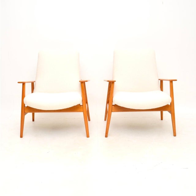 A stylish and extremely well made pair of Danish vintage armchairs in birch wood. They were recently imported from...