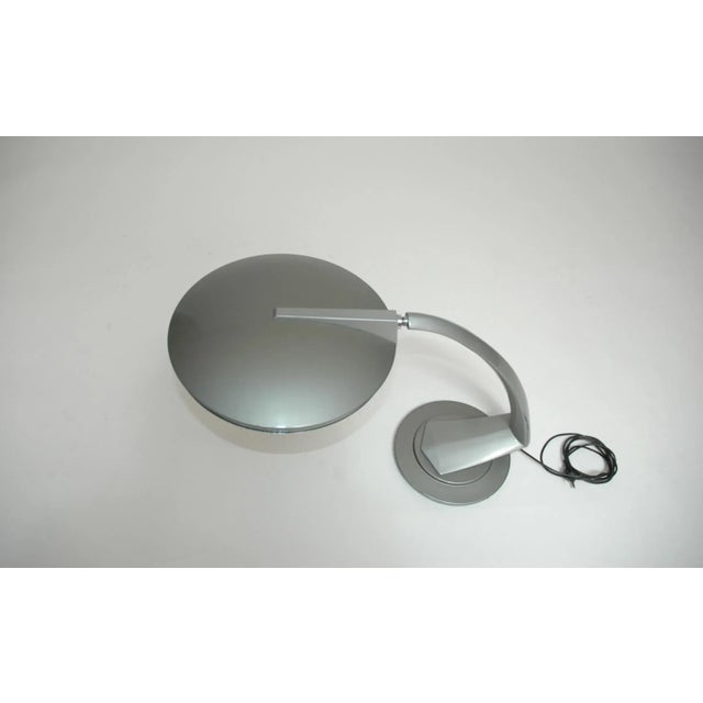 A desk lamp from the Spanish manufacturer Fase. It was designed in the 1960s. This is the model Arco. It features the...