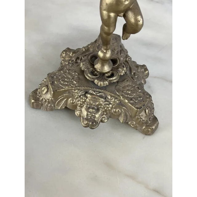 Pair of metal candelabra (probable bronze), Italian production of the 60s. Intact. Small signs of the time.