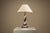 Some objects draw attention through ornament, others through the quiet confidence of their form. This Murano table lamp...