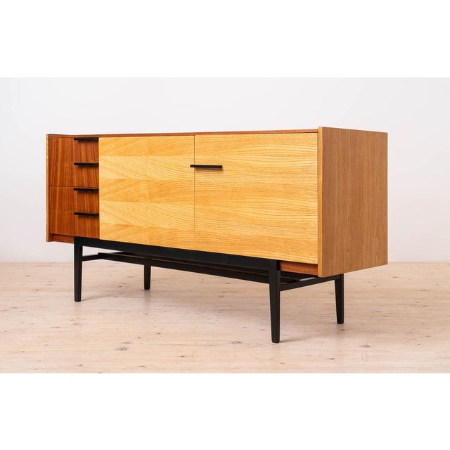 This exquisite sideboard, crafted in the 1960s in former czechoslovakia, exemplifies the epitome of mid-century modern...