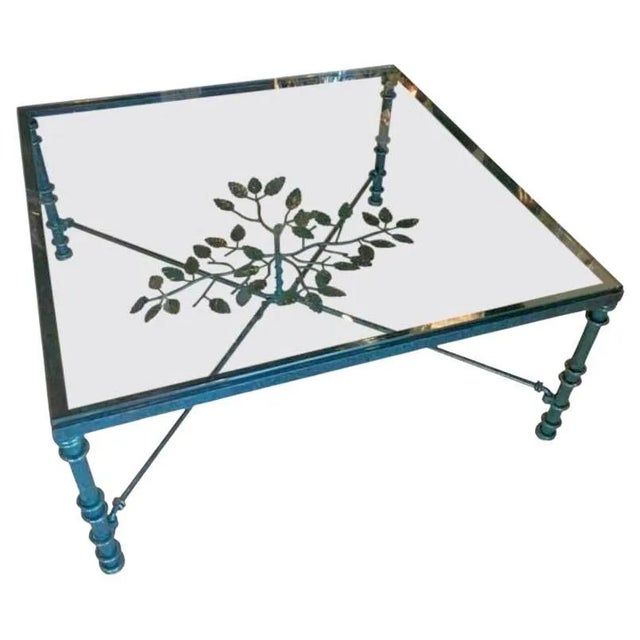 Vintage square coffee table with glass top with verdigris green patina and tree leaf details in the manner of Diego...