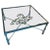 Vintage square coffee table with glass top with verdigris green patina and tree leaf details in the manner of Diego...