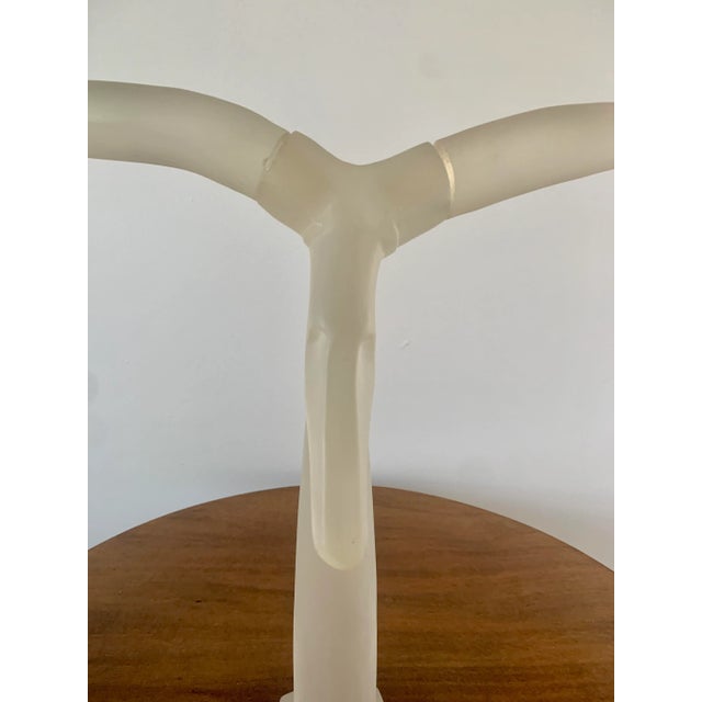 A striking mid-century modern lucite ram’s head sculpture with sweeping stylized horns and a clean, sculptural silhouette....