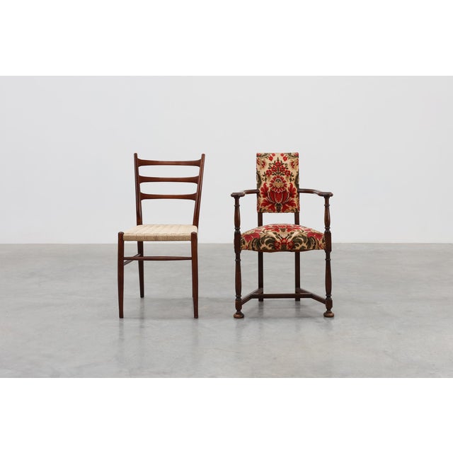 A charming late‑19th‑century French chair in the Louis XIII style, featuring a solid wooden frame with turned legs and arm...