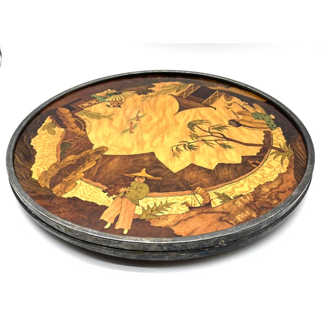 This artfully handcrafted inlaid platter from Asia depicts richly detailed rural and peasant scenes, strikingly depicting...