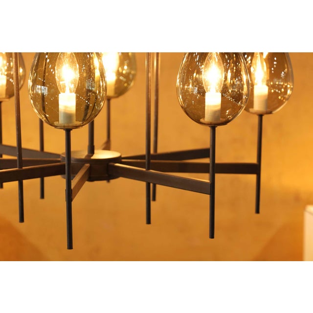 Experience the epitome of sophistication with this beautiful two-tier chandelier by Lightolier, exclusively offered at...