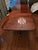 A Maitland Smith double-pedestal dining table captures the essence of classic elegance and artisan precision. Its book-...
