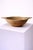 A rare and soulful early 19th-century Swedish hand-carved wooden bowl, accompanied by its original iron cannonball,...