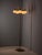 Elegant vintage floor lamp featuring a slender brass-colored metal stem with five curved arms and five opaline glass...
