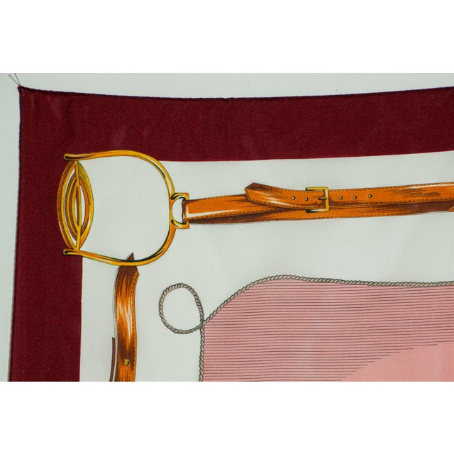 Vintage pink scarf with horse carriages motif. 1970’s vintage Gina Renoir equestrian scarf featuring a coachman on a...