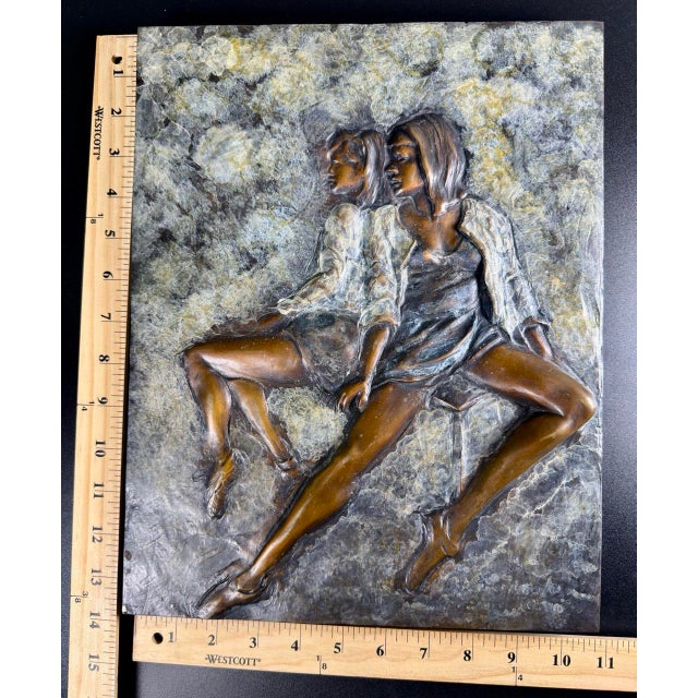 This distinctive artwork of two women laying back to back is the work of artist Huberto Maestas, a prominent American...