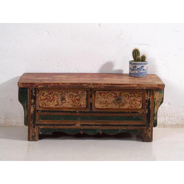 Low kang table with two drawers in elm wood and polychrome decoration, originating from shanxi province in northern china...