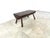 Brutalist 4 legged coffee table with a solid wooden top. Great piece to contrast modern day interiros. Charming patina....