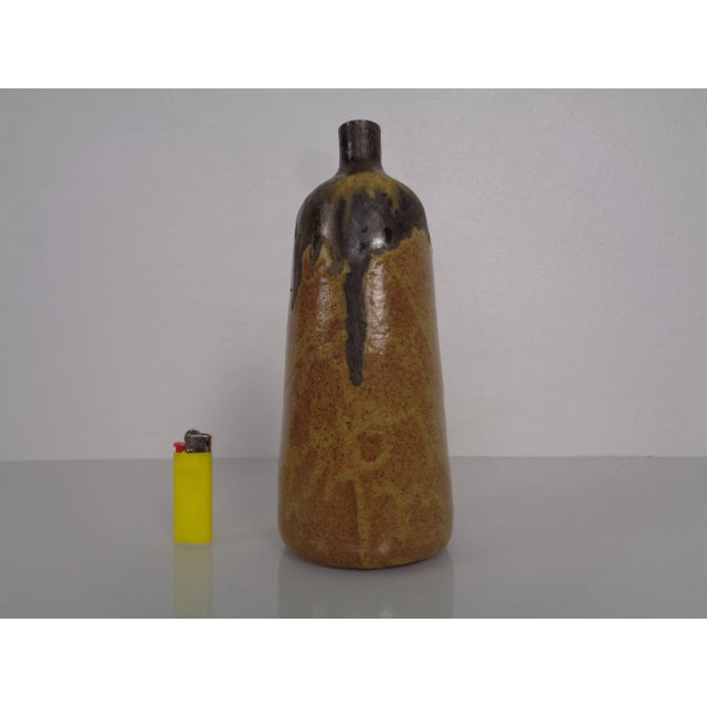 Stoneware vase from the 1960s. Signed on the underside. Very good condition, no damage.