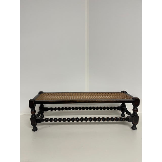 An antique English dark stained oak framed low-profile footstool bench with beautiful turned legs, ball feet, full length...
