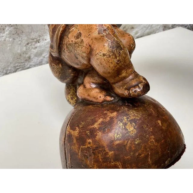 Delicate spanish carved wooden cherub, gilded and polychrome painted, circa 1930. A devotional piece with baroque revival...