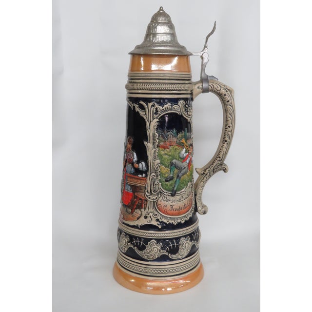 This wonderful Extra large vintage beer stein is made of ceramic with a pewter lid. It features a marvelous depiction of 3...