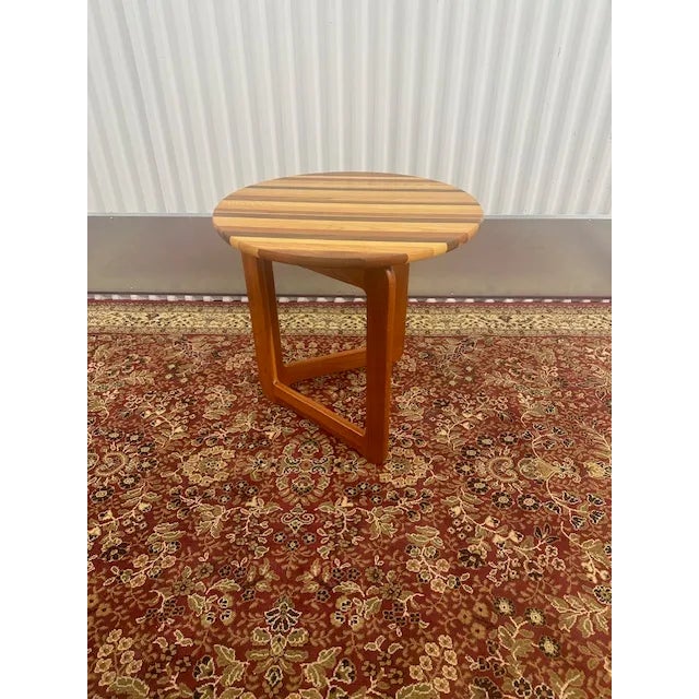 Elevate your living space with our Mid-Century Danish Teak Side Table featuring exquisite craftsmanship and timeless...