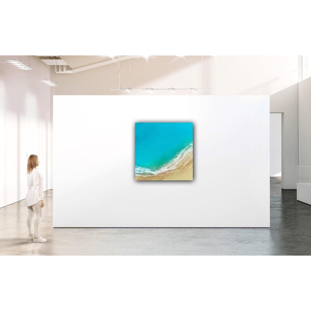 Everglowing Ocean captures the serene beauty of the shoreline, where vibrant turquoise waters meet soft sandy beaches. The...