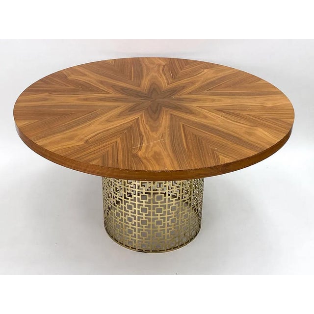 A wonderfully modern, and completely designer, table by Jonathan Adler. The table consists of a pierced brass base topped...