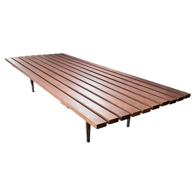 Large oversized minimalistic modern slatted deep bench or daybed in the style of George Nelson. This mid-century style...