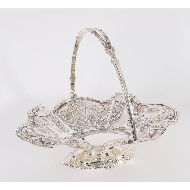 This is an exceptionally fine antique English Victorian silver-plated fruit basket with hallmarks for the celebrated...