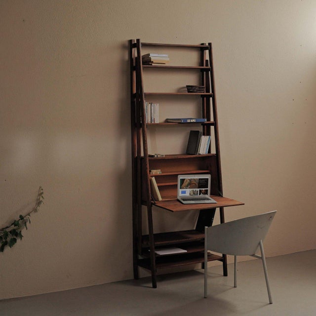 Handcrafted secretary bookcase, made from pine and oak around 1960, features a tall, slender structure with gently splayed...