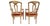 A pair of antique Louis XVI style open-back armchairs with distressed painted wood frames, gilt remnants, and recovered...