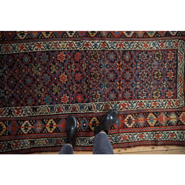 :: Starburst geometric floral design motifs covering the main field wrapped by a wide banded main border with dramatic...