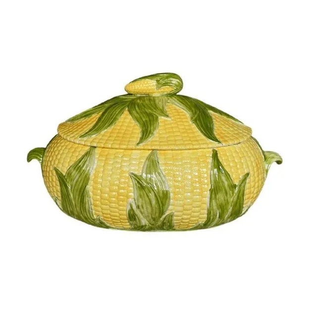 A wide corn motif ceramic serving tureen. Hand-painted in yellows and greens, this lovely dish is wide and oval in shape....