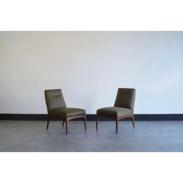 Set of petite slipper chairs by Erwin Lambeth, circa 1950s, fully restored by Stamford Modern. These elegant chairs...
