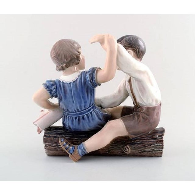 Rare Dahl Jensen figurine No. 1214. Girl and boy with ship. Jens Peter Dahl Jensen. Measures: Length 21 cm. Height 18 cm....