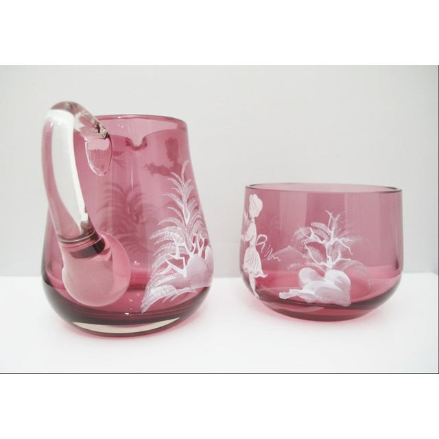 Mary Gregory vintage Czech glass sugar bowl and creamer pitcher. Each with white enameled figural decoration. Bowl...