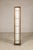 This vintage Japanese floor lamp embodies the clean geometry and quiet elegance of traditional shoji design. The tall,...