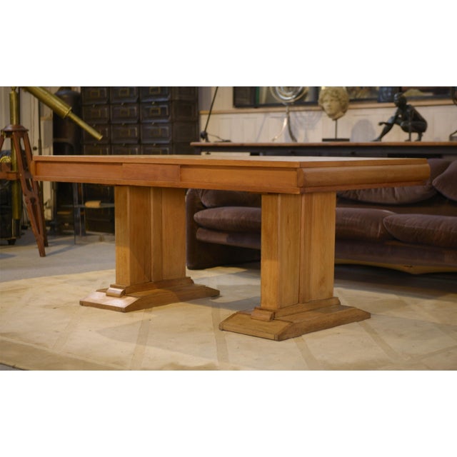 Beautiful oak table from the 1940s, in the late Art Deco style. Its top features a checkerboard marquetry/parquet-like...