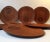 This set of eight egg or teardrop shaped breakfast plates in teak features a practical circular drill-out suitable for an...