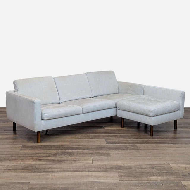 Features tailored blind-tufted seating and back with high density, high resiliency foam cushions and walnut legs. The...