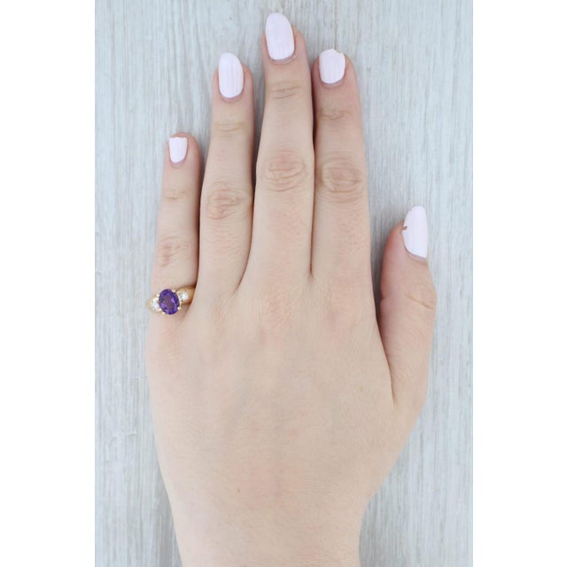 Gemstone Information: - Natural Amethyst - Carats - 1.50ct Cut - Oval Brilliant Color - Purple - Natural Diamonds - Total...