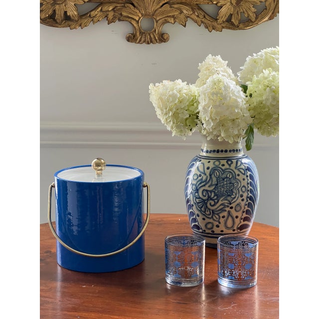 Add some color and patina to your cocktail space with this colorful vintage Kraftware ice bucket. The classic blue color...