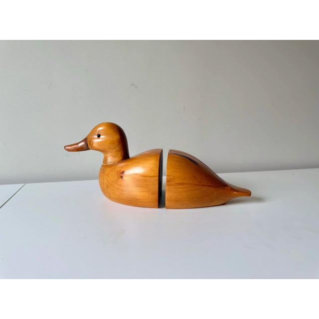 Handcarved vintage wooden duck bookends. One end is the upper body and the other the lower body. Crafted from Atelier...