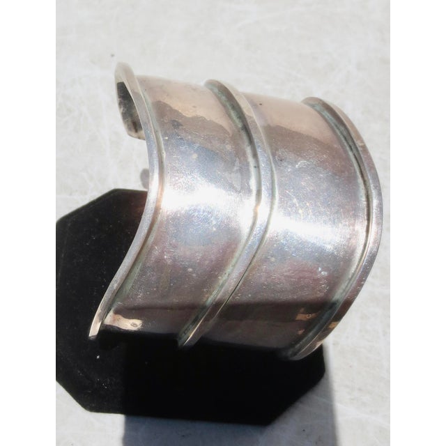 Bartels sterling silver cuff, Modernist wave design. Organic curve and wide sleeve. The measurements are 6.8". The width...
