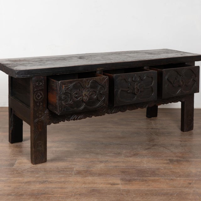 18th Century chestnut console table with three large carved drawers. The chestnut has developed a deep, rich patina...